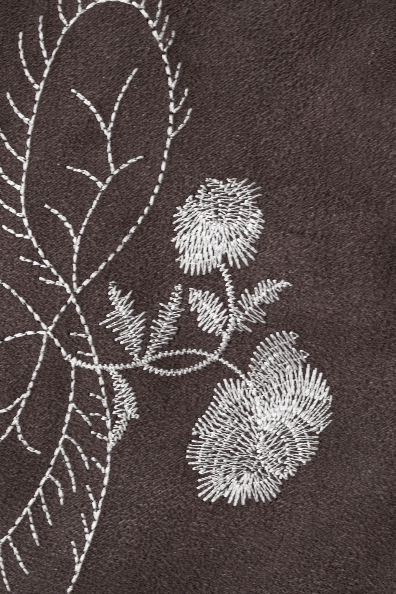 linen sampler with botanical motif
